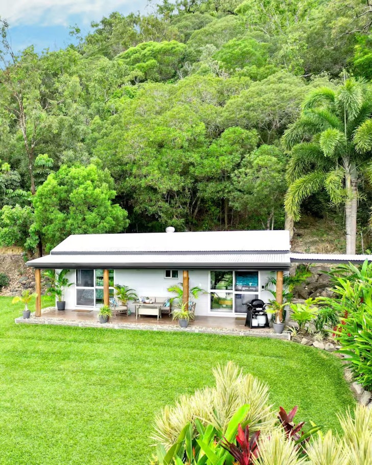 A view of Trezise Cottage surrounded by greenery, it's one of the best Port Douglas Airbnbs