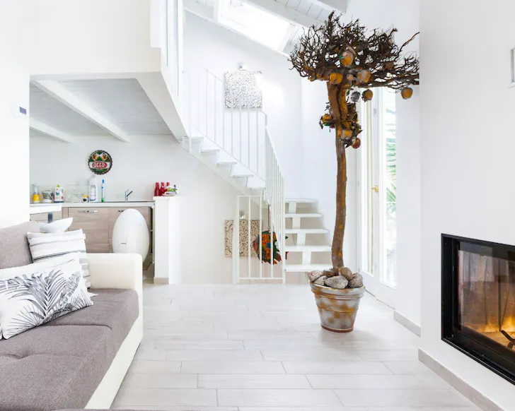 A view of the bright living space at Triplex Townhouse With Terrace  best Milan Airbnbs