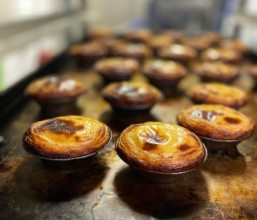A tray of freshly baked Pasta del Nata, or Portuguese tarts, from Tuga Pastries in Sydney. They are said to be some of the city's best. 