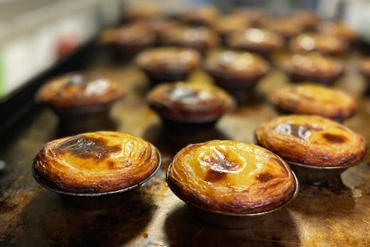 A tray of freshly baked Pasta del Nata, or Portuguese tarts, from Tuga Pastries in Sydney. They are said to be some of the city's best.