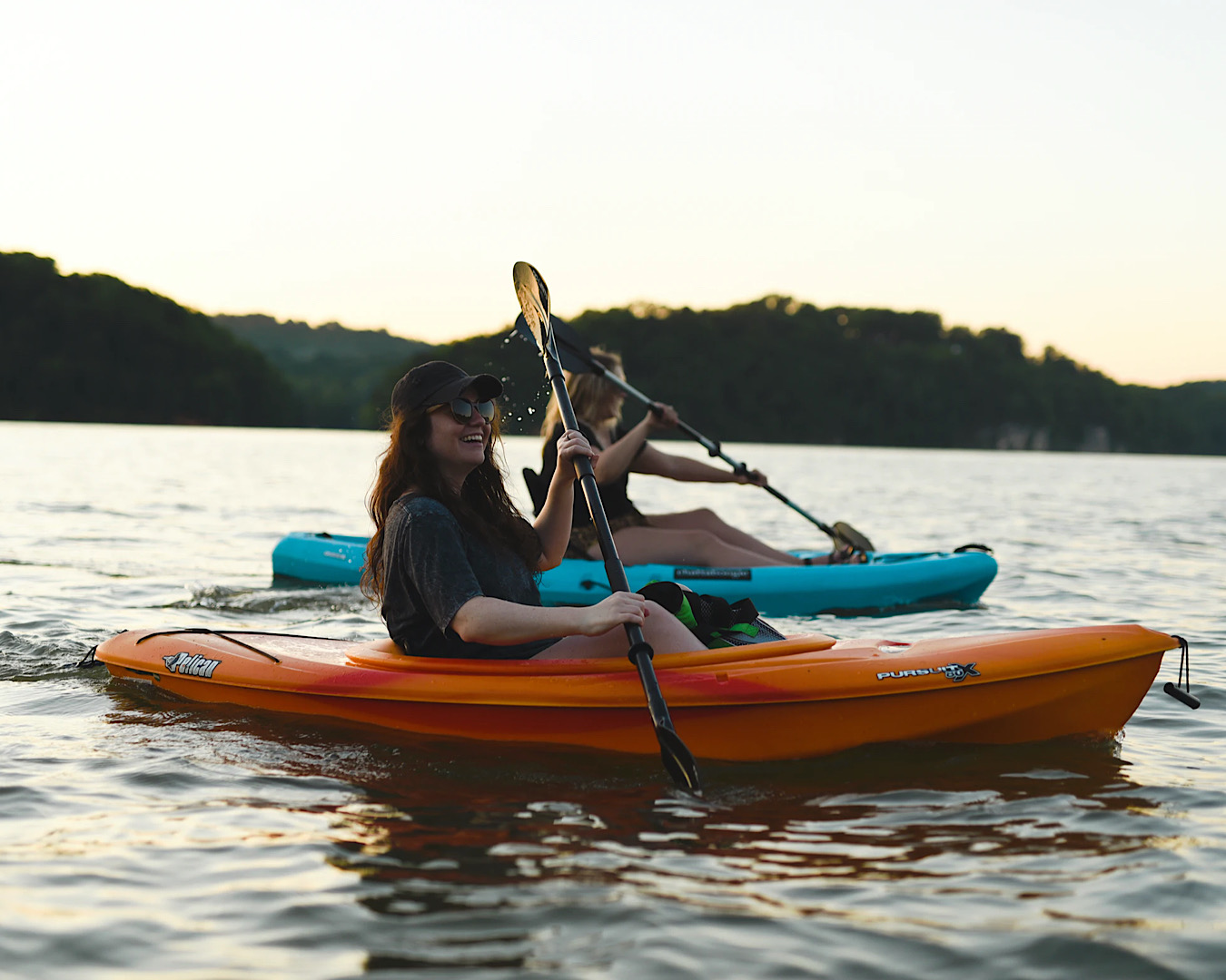 Two girls kayak. 