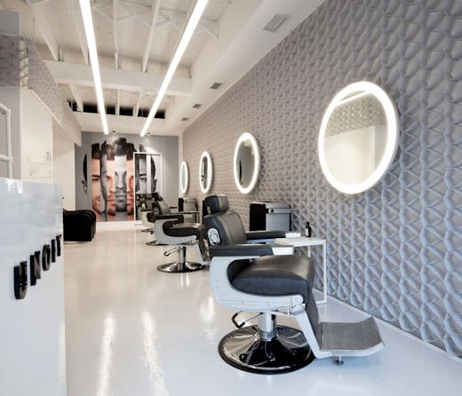 Rows of barber chairs at UNOIT in Darlinghurst. 