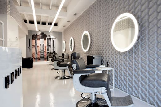 Rows of barber chairs at UNOIT in Darlinghurst.