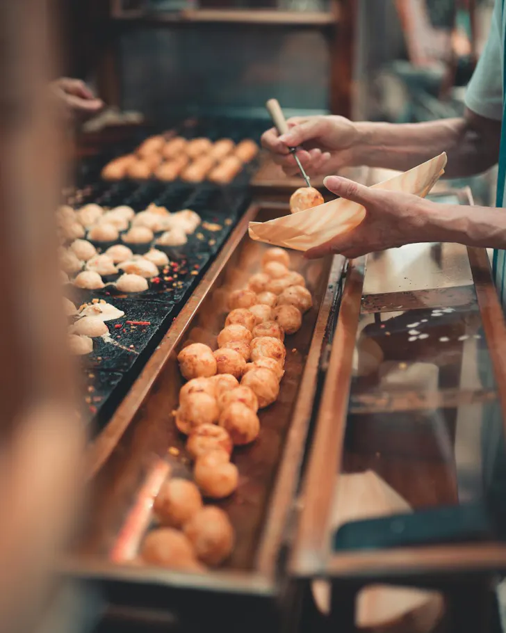 A golden line-up of takoyaki at Umaiya Osaka.