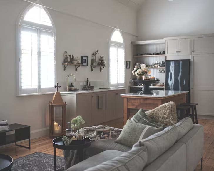 A view of the living space with character church windows at Under the Oaks one of the best Airbnbs near Adelaide