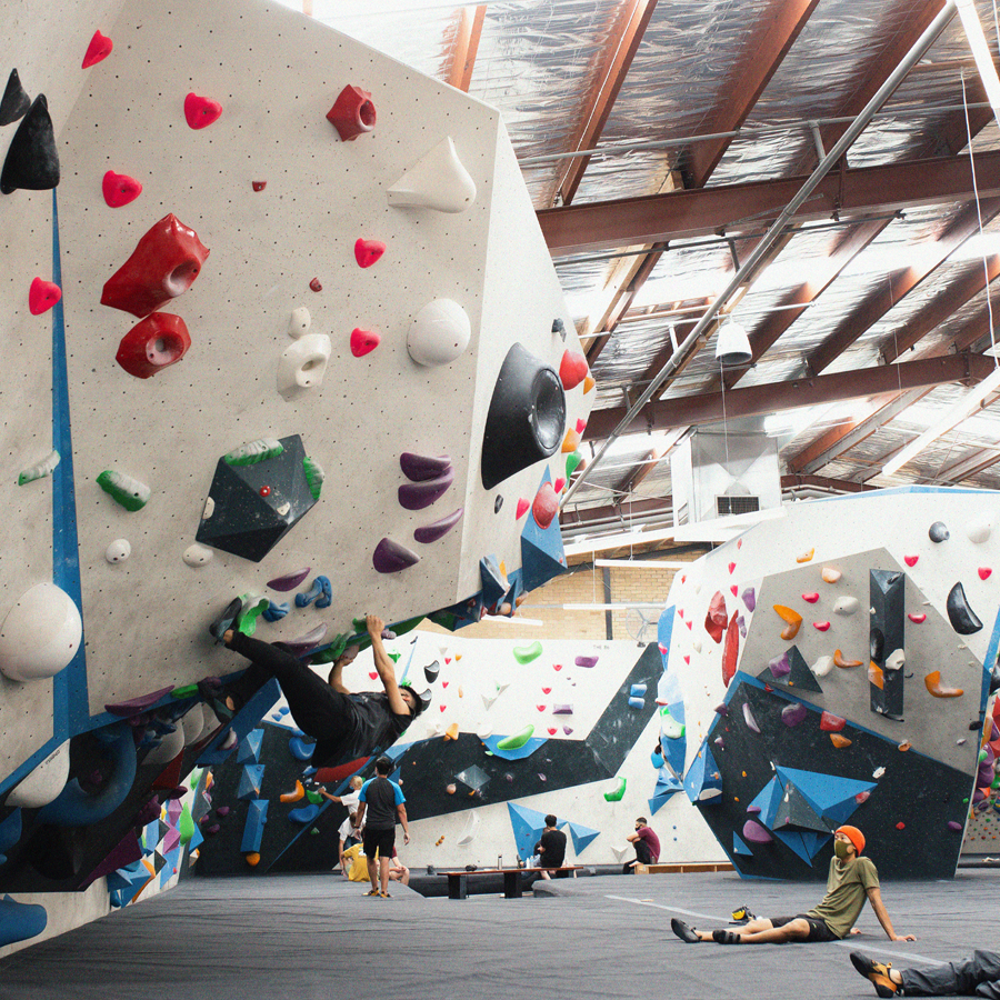 A person bouldering a wall at one of the best rock climbing Melbourne venues.