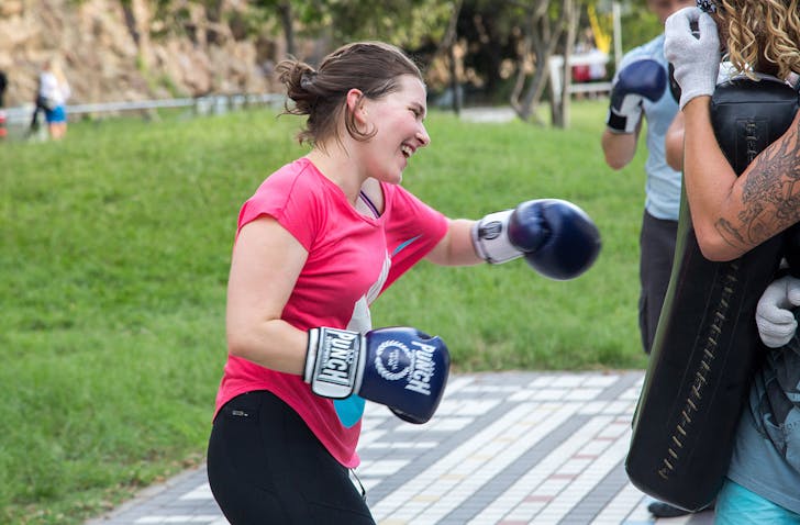 Person boxing in park.