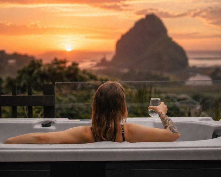 The putdoor bath with a view of Lion rock at The Little Louises best romantic stays near Auckland