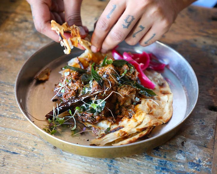 Tender lamb, black peppercorns, coconut oil, lachha paratha at V.T Station, one of the best restaurants in Newmarket, Auckland.