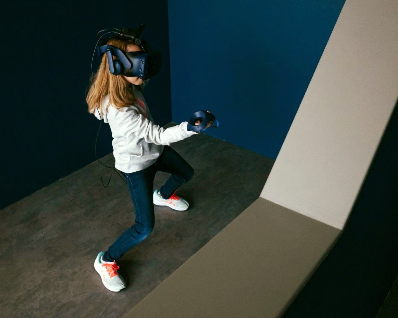 A girl wearing a VR headset at VR World