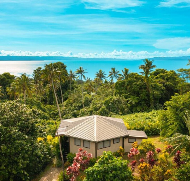 The exterior view of Vakanananu Retreat with the sea in the background, Fiji