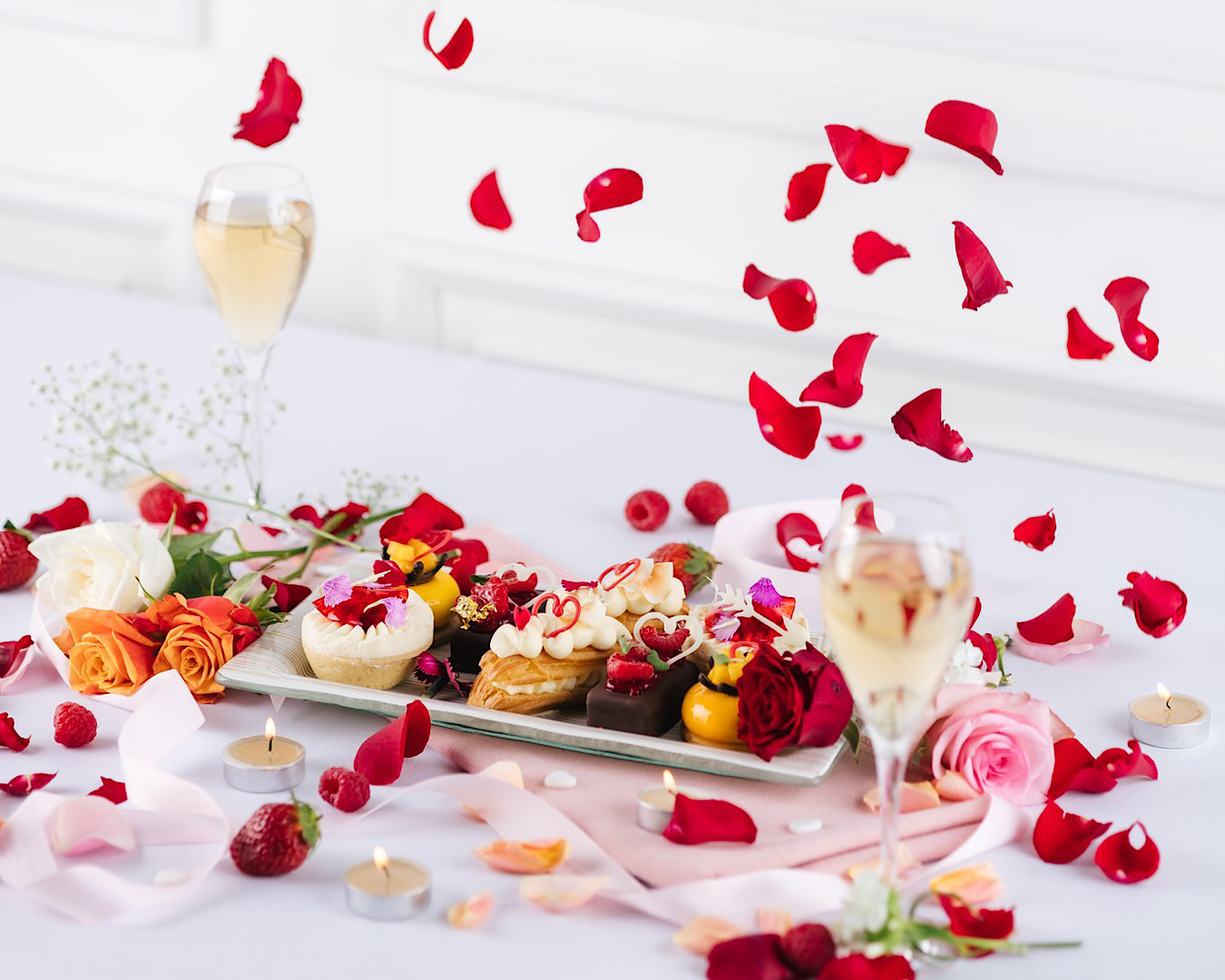 Rose petals fall around a gorgeous-looking Valentine’s Day High Tea by Cordis. 