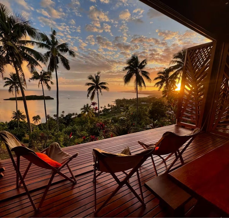 Chairs on the deck looking out of the sea at Vei We Kani Villa Airbnb Fiji