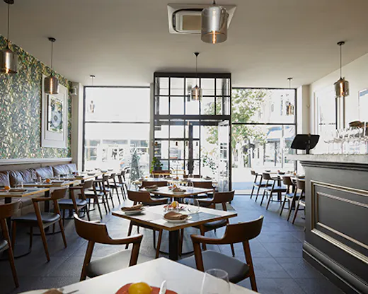 The inside of Vesper with wide shop front glass window. 
