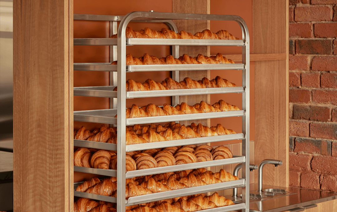 A shelf full of freshly baked croissants at Via Porta, a part cafe part bakery serving one of the best breakfasts in Melbourne