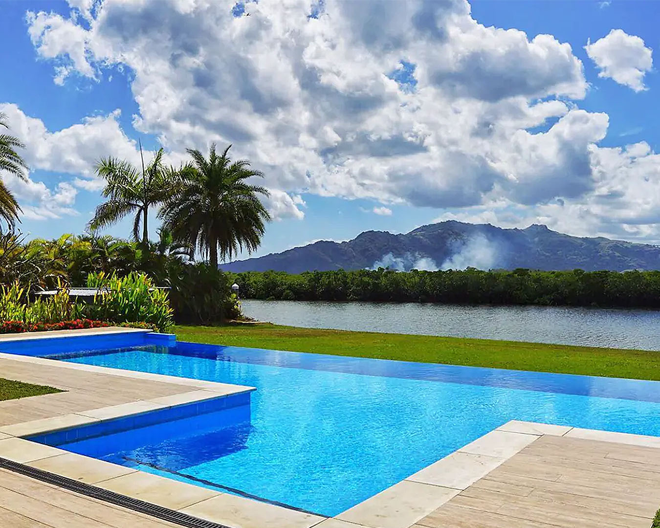 A stunning infinity pool with mountains in the background.