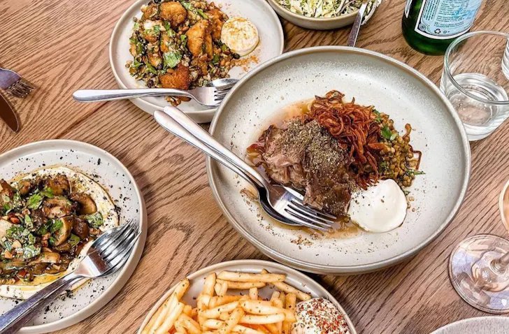 Plates of food on a table at The Kyn restaurant in Torquay