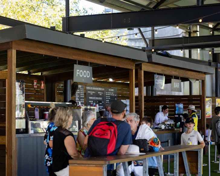 People sitting under cover