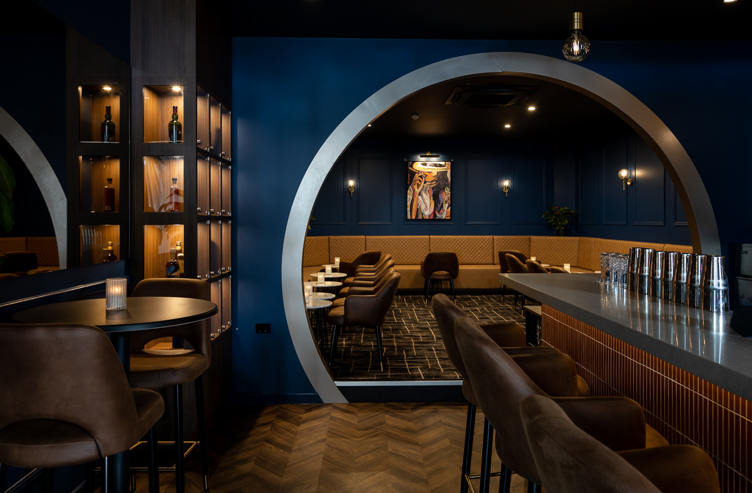 the interior of a blue and gold whisky den