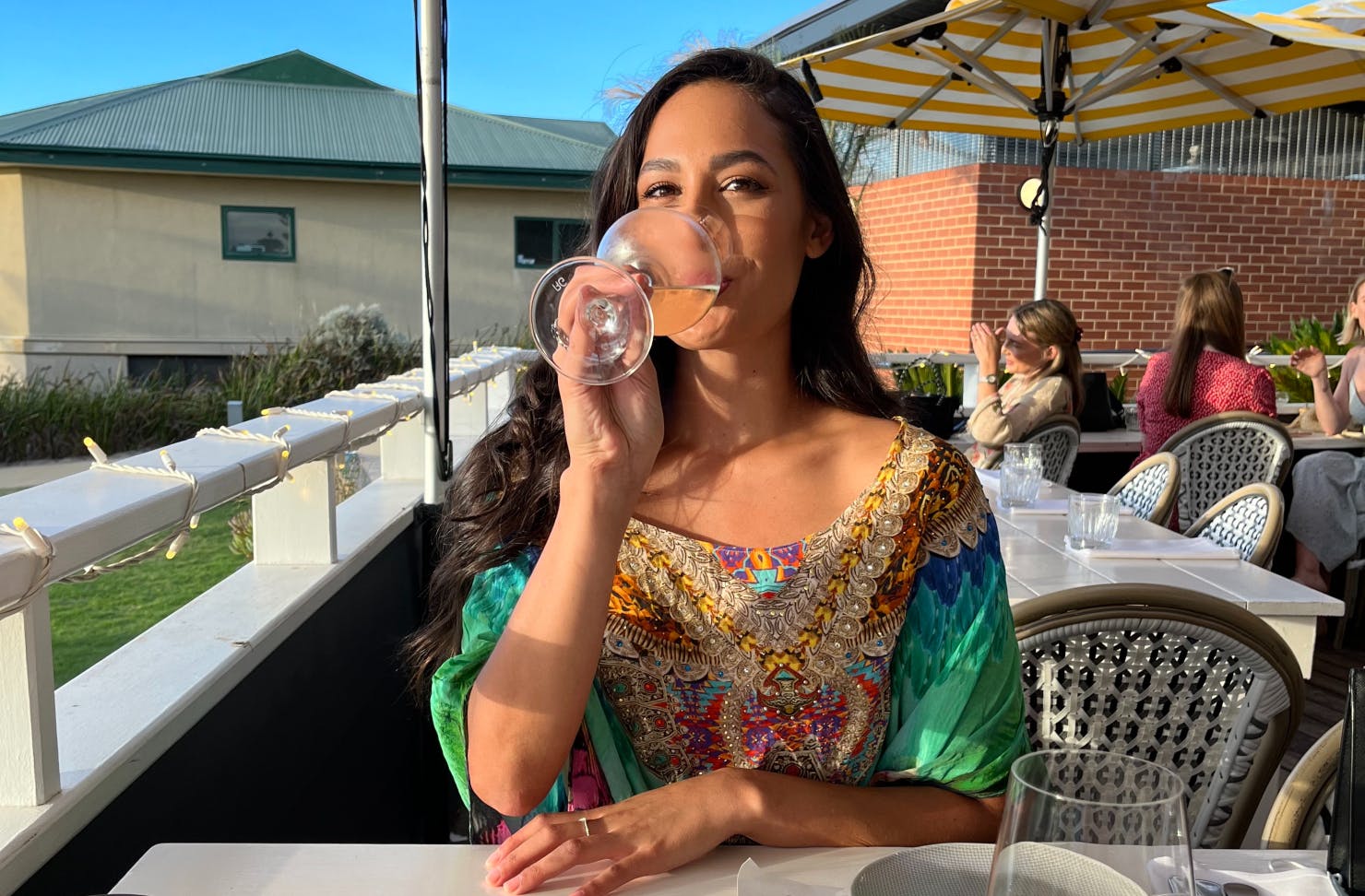 Woman drink wine in the sun