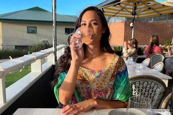 Woman drink wine in the sun