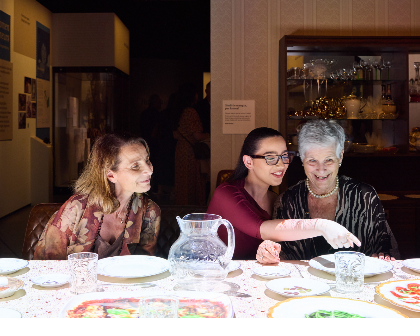 Three people sitting at table