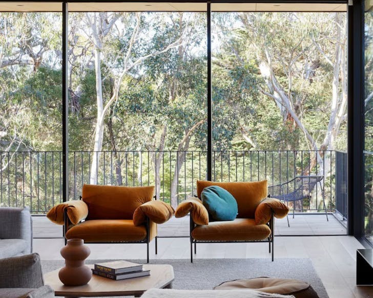 Two chairs in front of a window