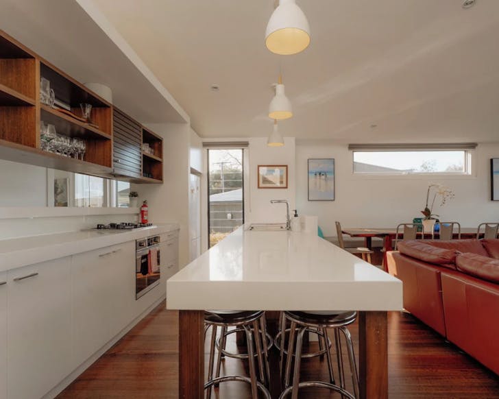 Kitchen with a white bench