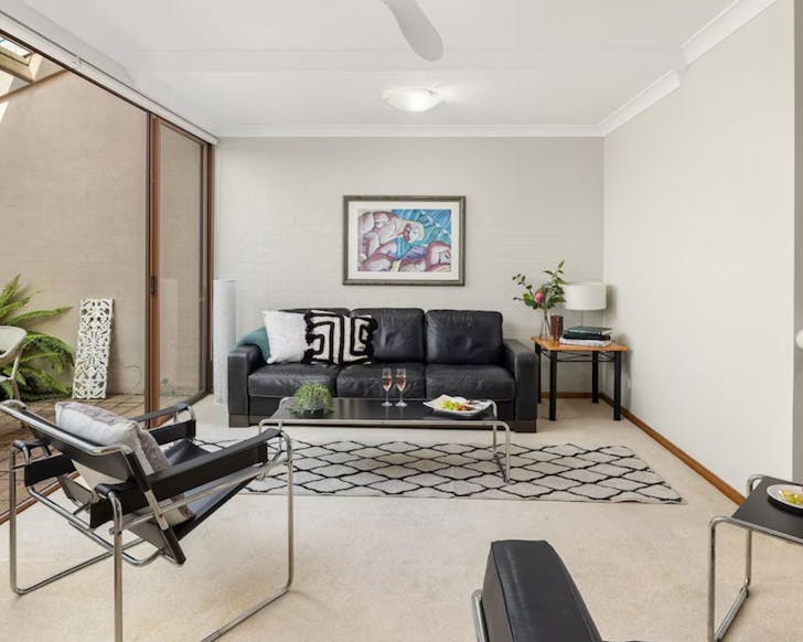 Couches in a white room.