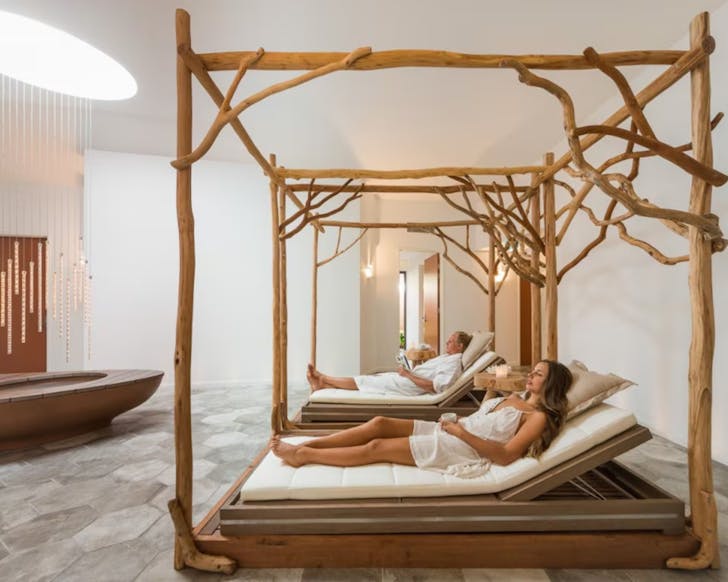 Two people sitting in beds