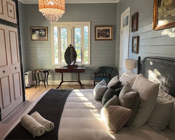 Bedroom with bed, closet and vanity