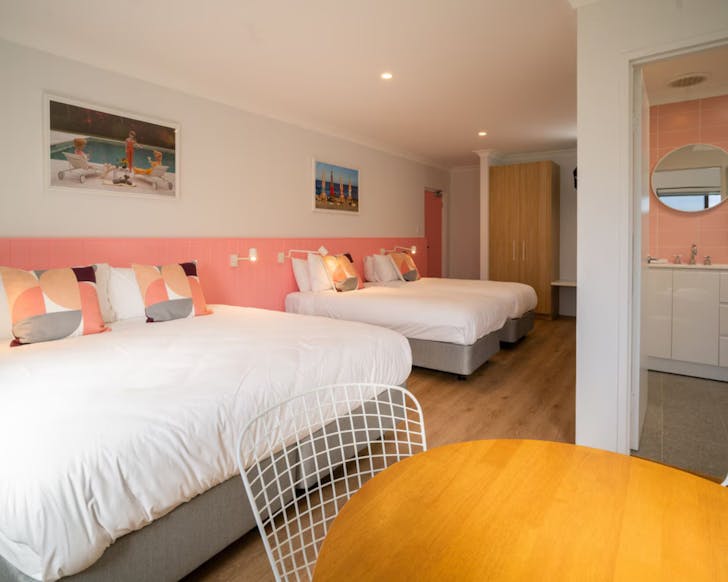 Two beds and bathroom