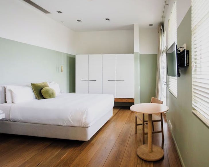 Bed and tv in room