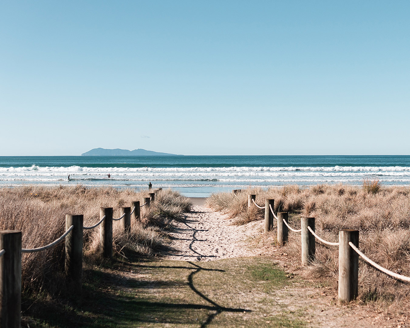 A wide path leads down to the beach at Waihi.