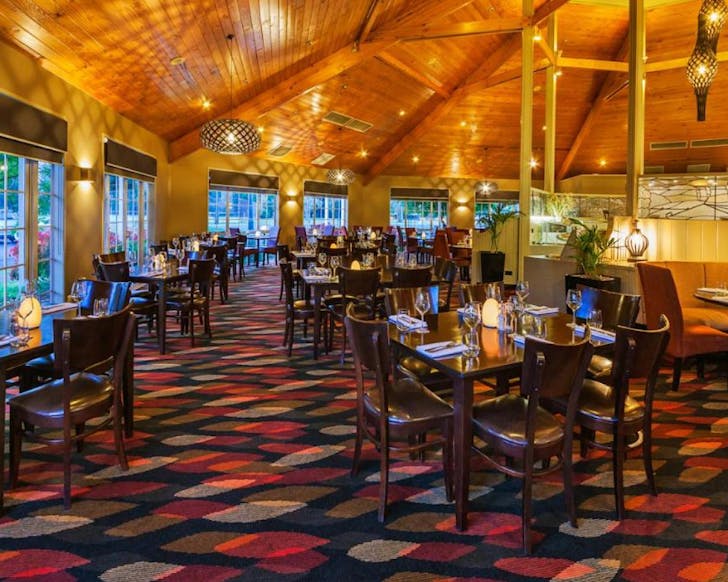 A golden glow dining room at Wairakei Resort Taupo that just screams 90s glam. 