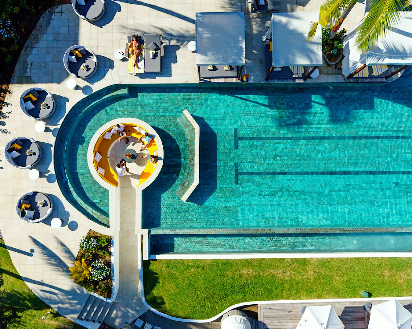 Aerial view of a circular outdoor lounge within a pool at Sofitel Fiji’s adults-only Waitui Beach Club. 