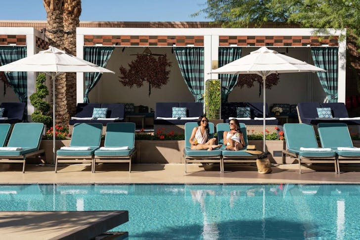 Guests enjoying their poolside stay at the Waldorf Astoria, a Las Vegas hotel