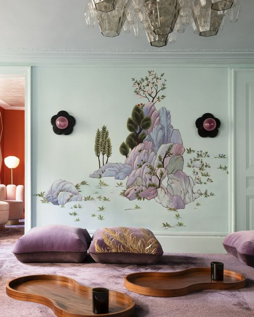 de Gournay mural wallpaper against a mint green wall. 