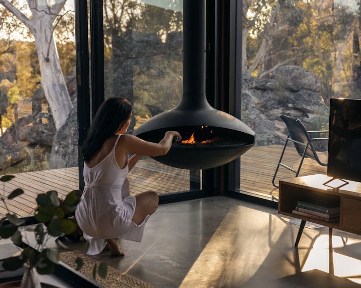 The suspended fireplace at Wambal Cabin nature Airbnb NSW