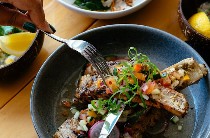 Cutting into a dish from War Pacific Fusion, one of the best eateries in Parnell. 