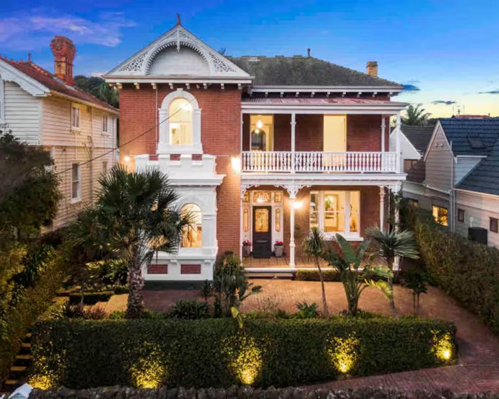 The exterior view of the stunning Waterfront Victorian Villa one of the best Auckland Airbnbs