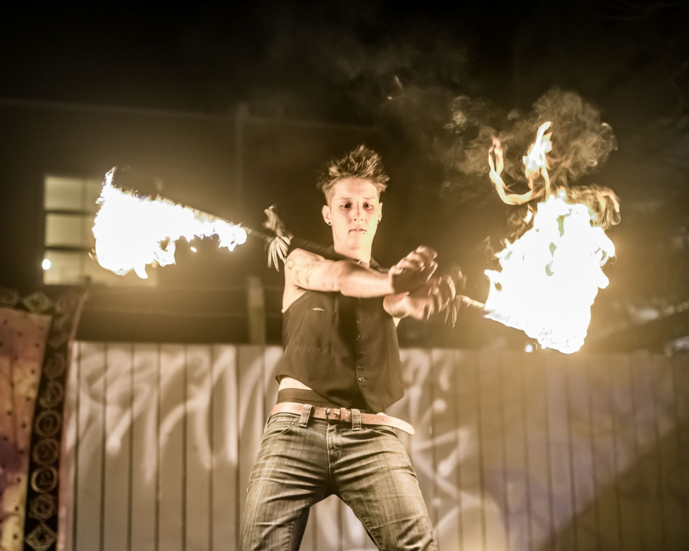 A person performing an act with fire
