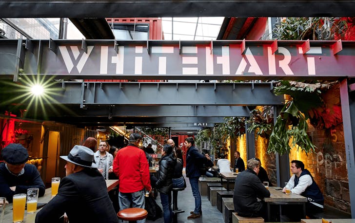 An outside space filled with people drinking at one of the best cbd bars in Melbourne.