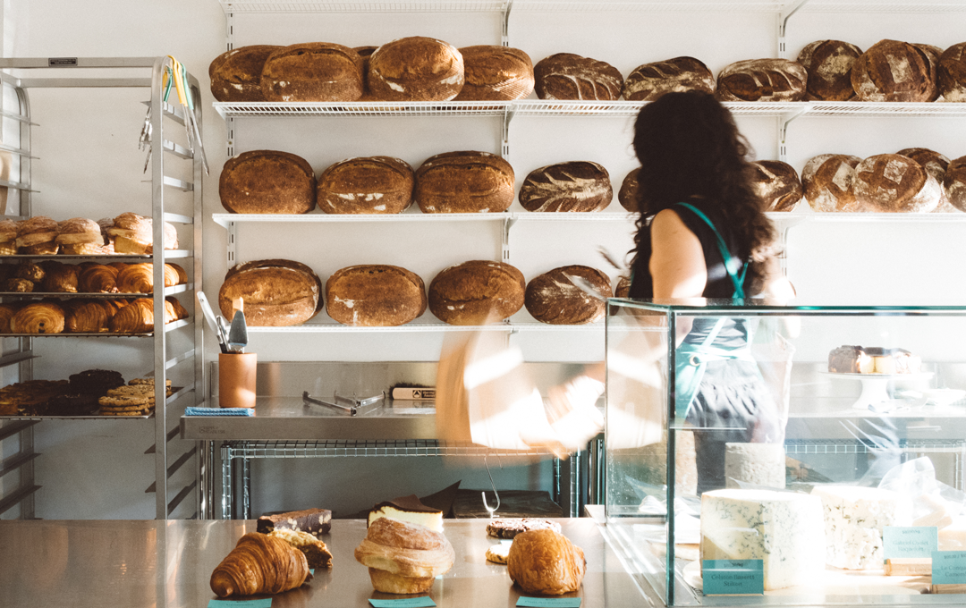 A light-filled space, one of the best Brunswick cafes with shelves of bread and croissants