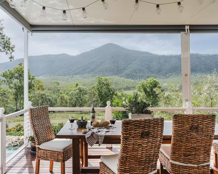 The dining table on the deck at Wildflower Mountain Haven one of the best farm stays near Brisbane