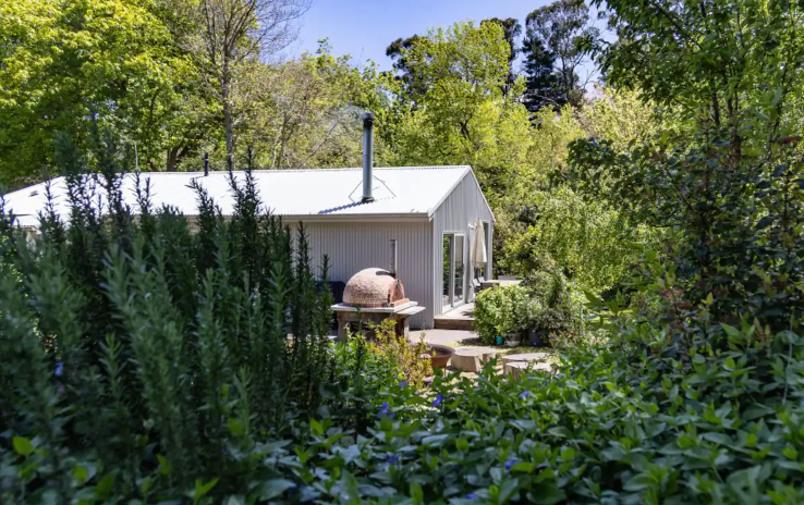 A small cottage with a pizza oven, one of the best pet-friendly Airbnbs in Victoria.
