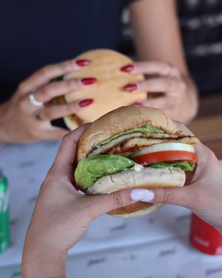 Women holding burgers (@littlelburgers)