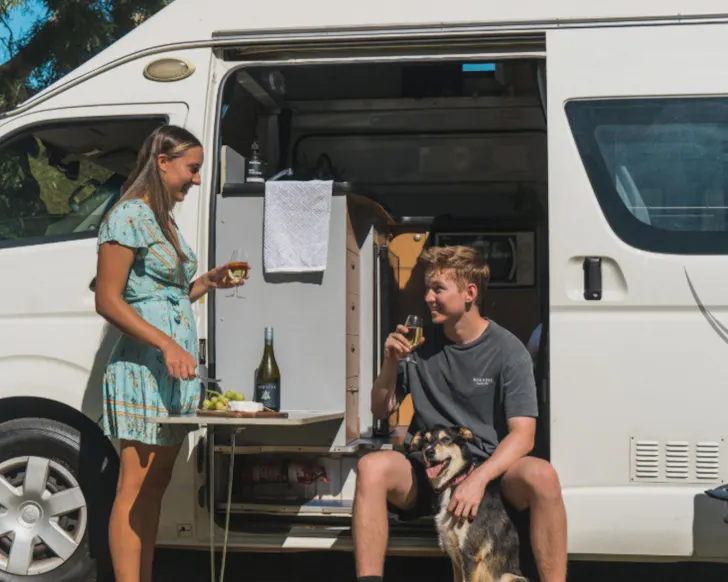 Two people and their dog at Wow Wagon best family campervan hire Perth WA