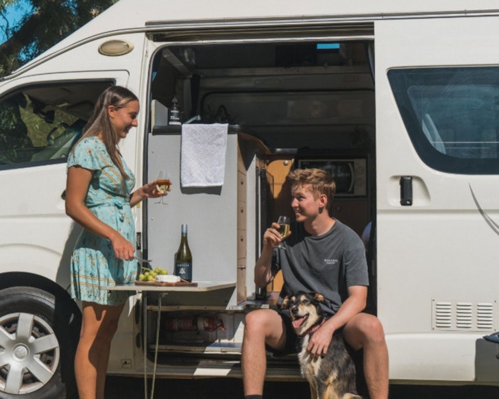 Two people and their dog at Wow Wagon best family campervan hire Perth WA