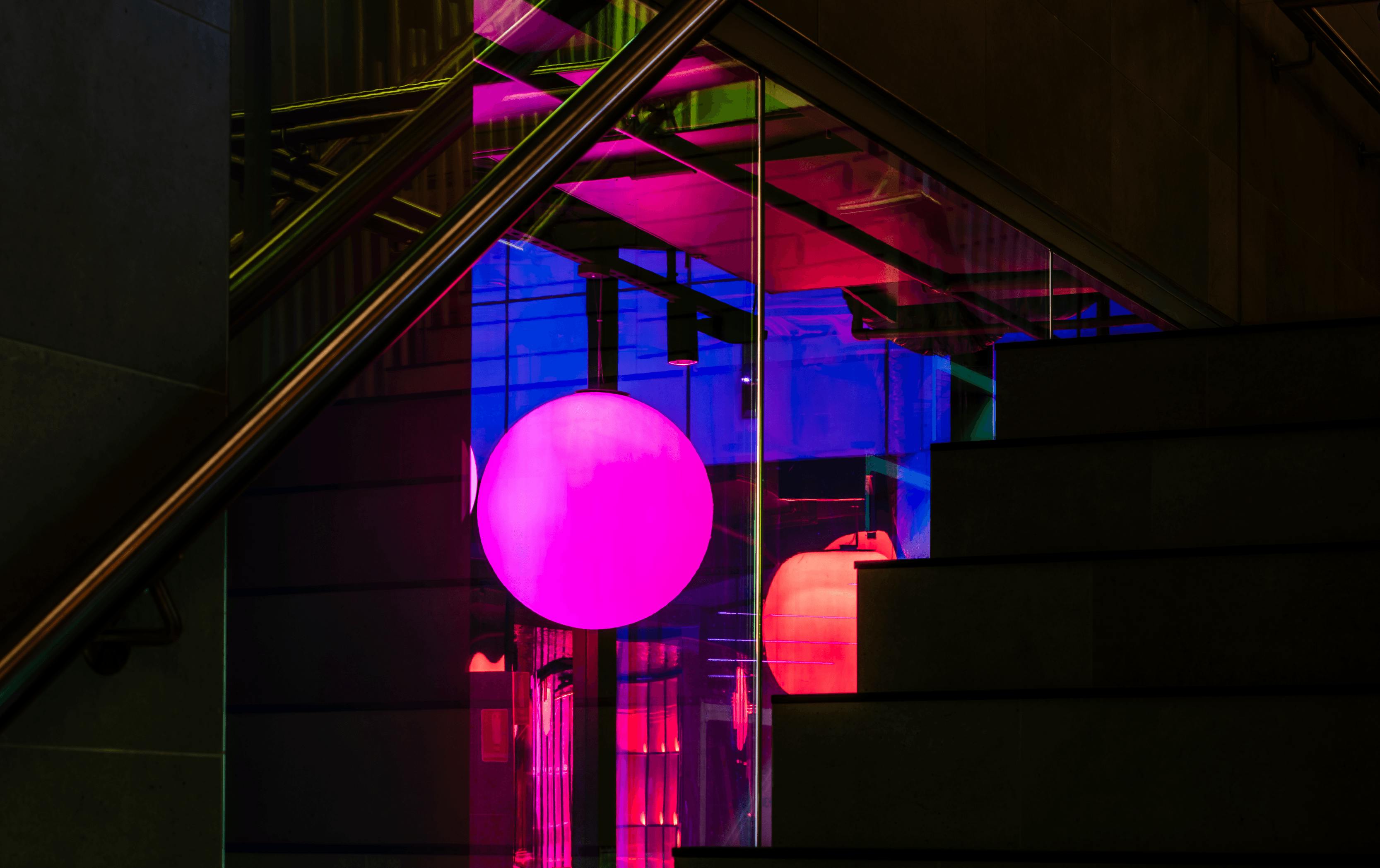The inside of Yakimono with a purple and pink light 